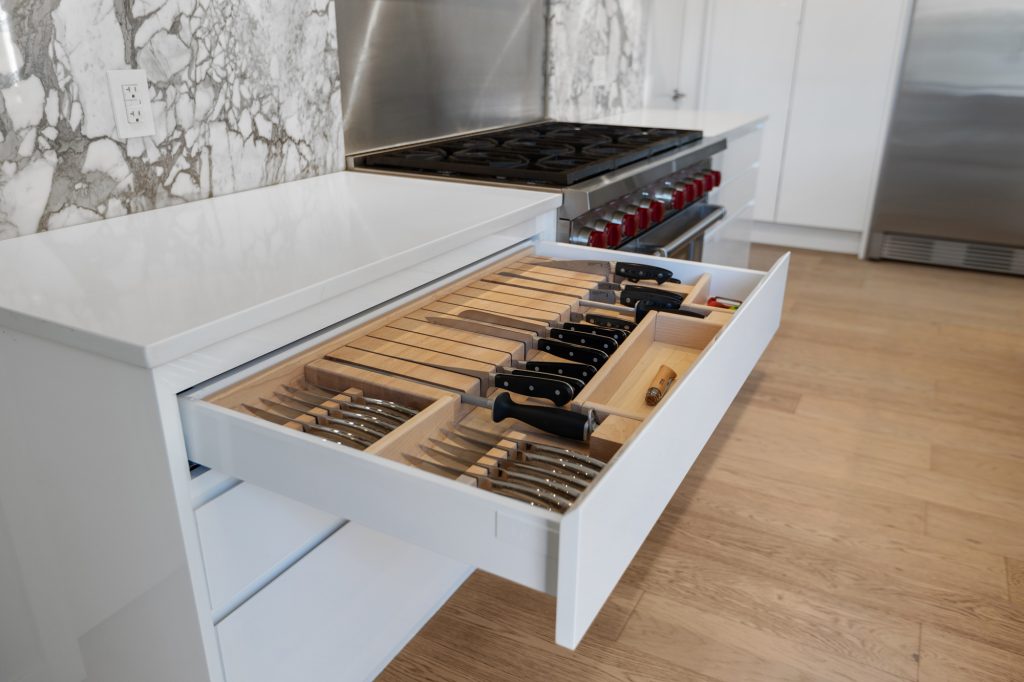 kitchen design scheme incorporating wood, marble & white